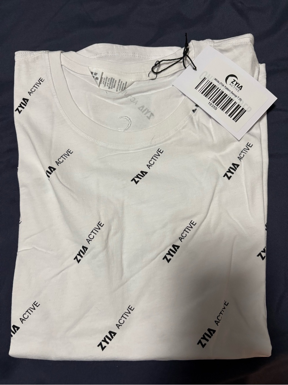 ZYIA White Short-Sleeve Swoop Tee
